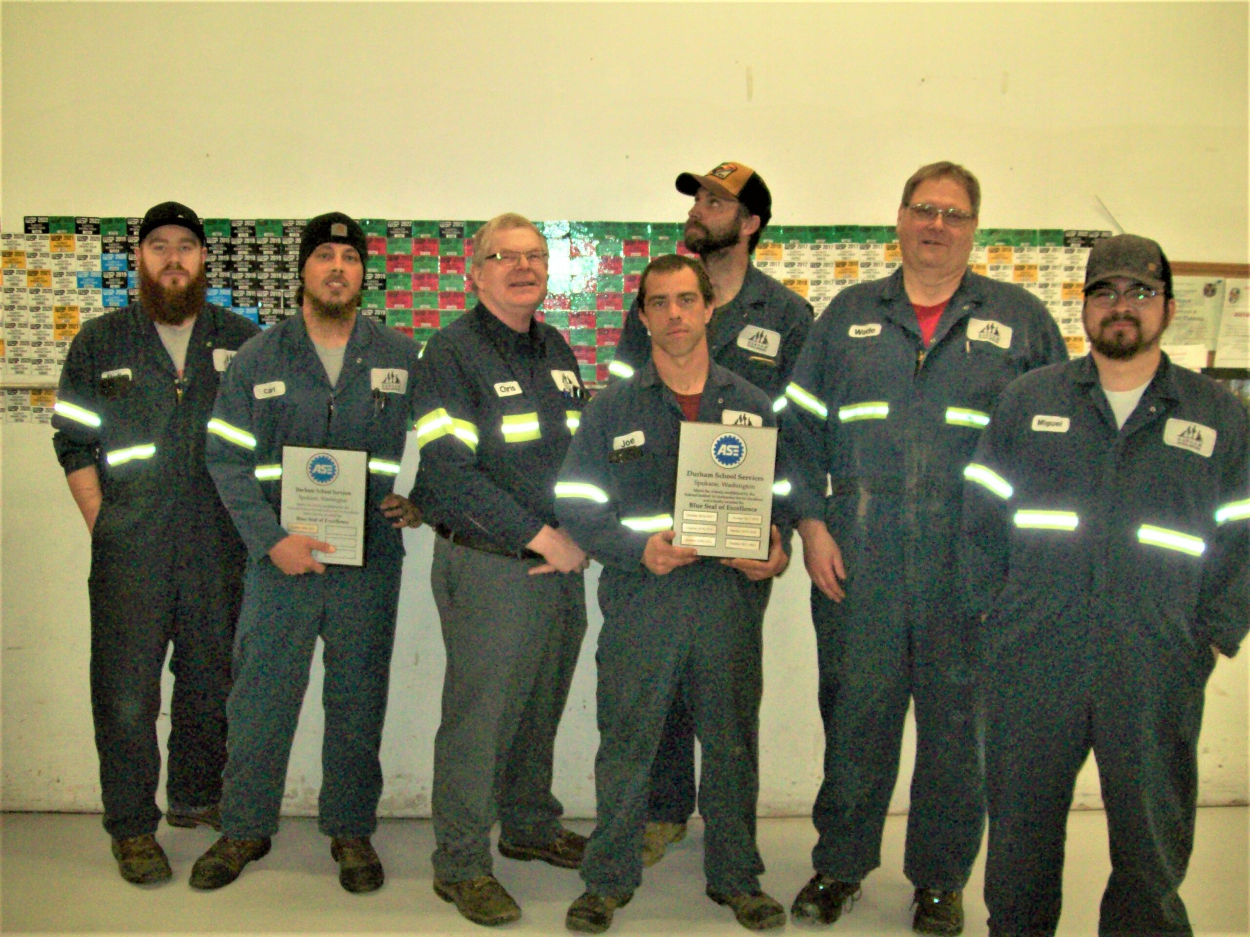 Team in Spokane, WA, holding their ASE Blue Seal of Excellence Plaque